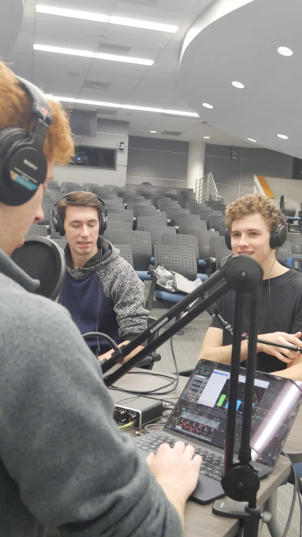 Beyond ME co-hosts checking microphones and recorder levels
